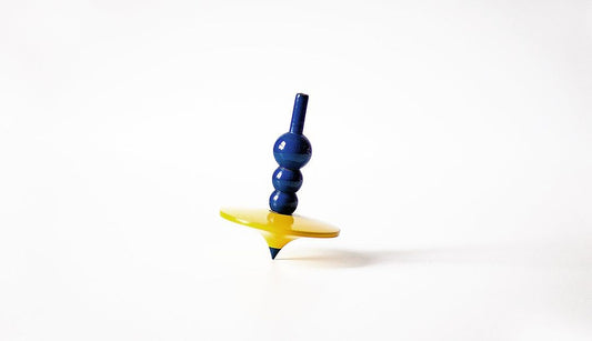 Beyond Toys: Wooden Spinning Tops as Artifacts of History and Creativity