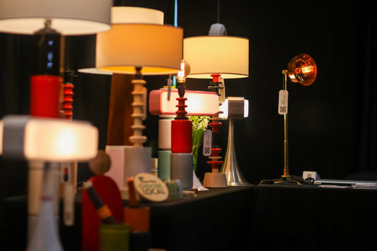 Rows of colourful lamps on table