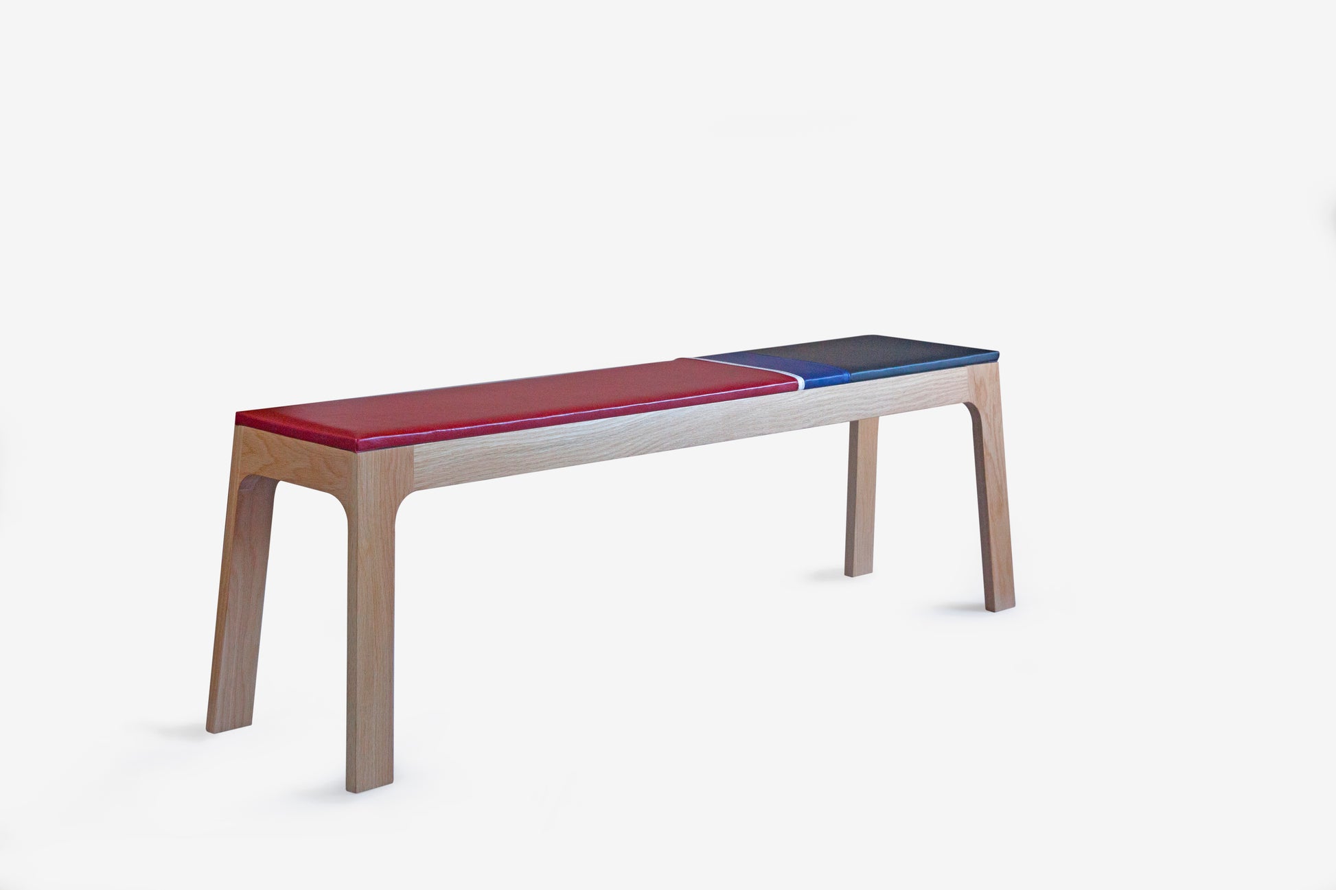 wood bench with red and blue upholstery 