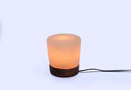 Lampade e portacandele in sale rosa di Potohar